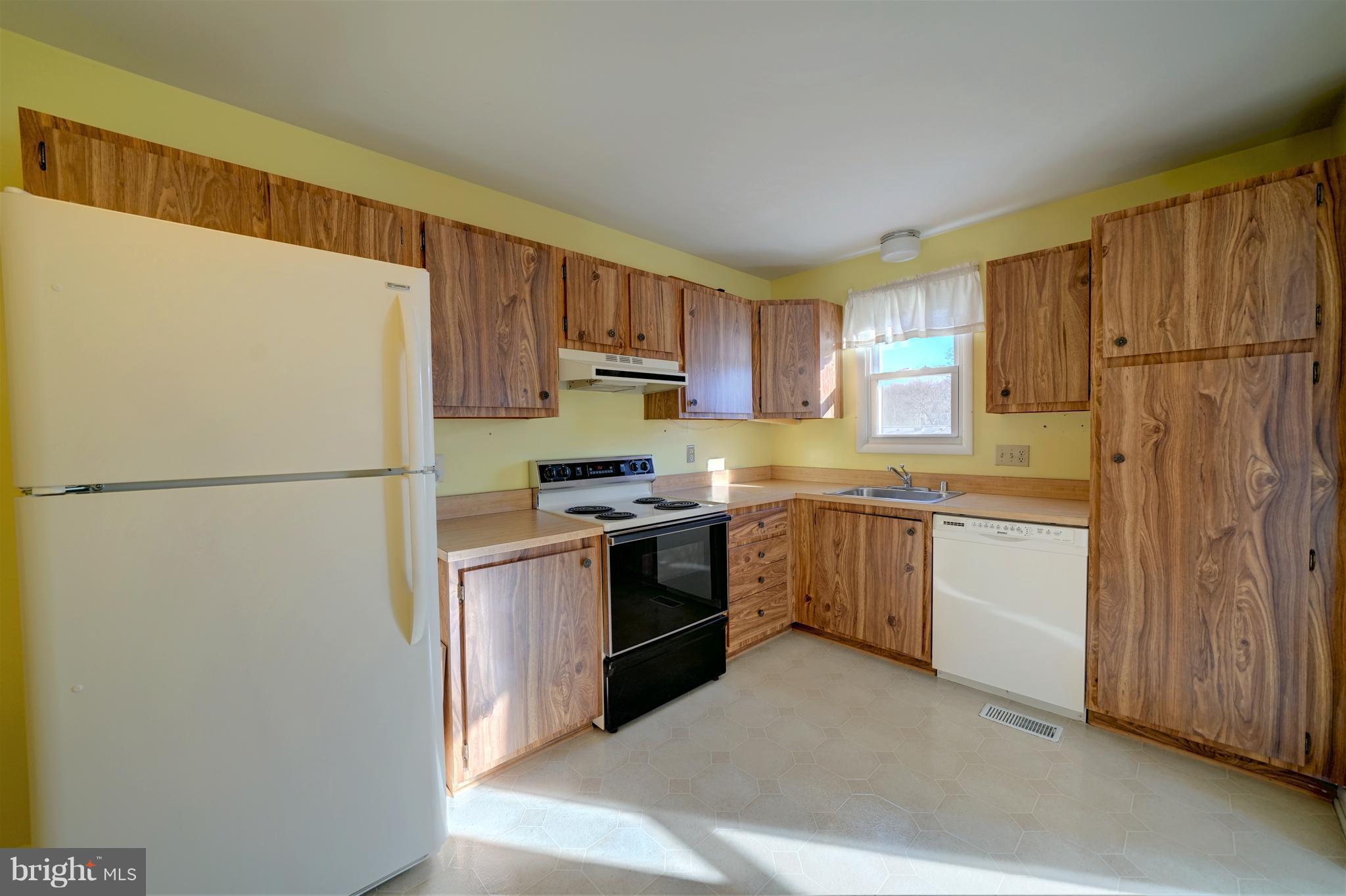 9923 Maidbrook Road Baltimore, MD 21234 - Photo 12 of 30 Kitchen has pantry cabinet and all appliances