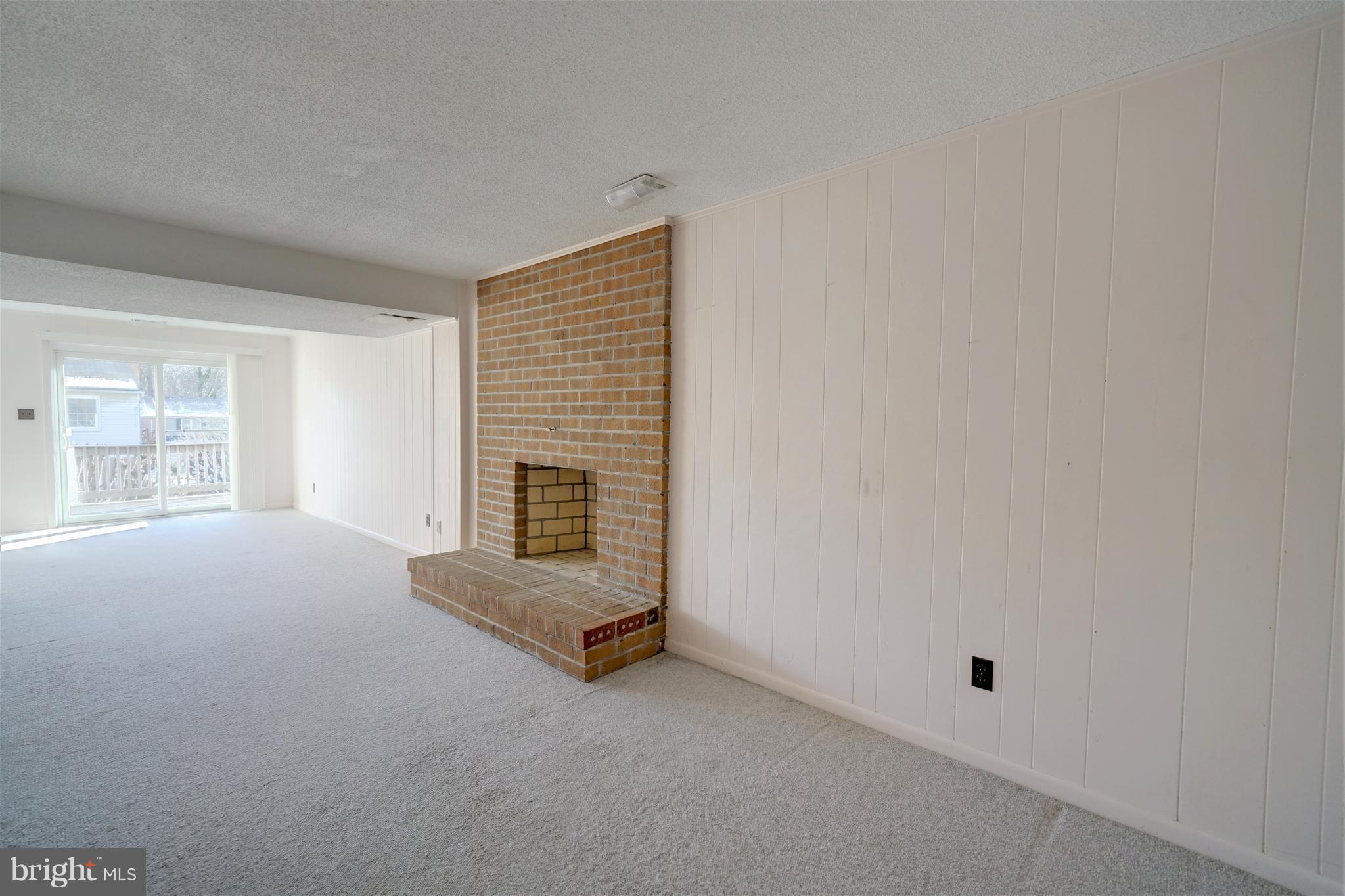 9923 Maidbrook Road Baltimore, MD 21234 - Photo 15 of 30 Family Room w/wood burning fireplace and walkout