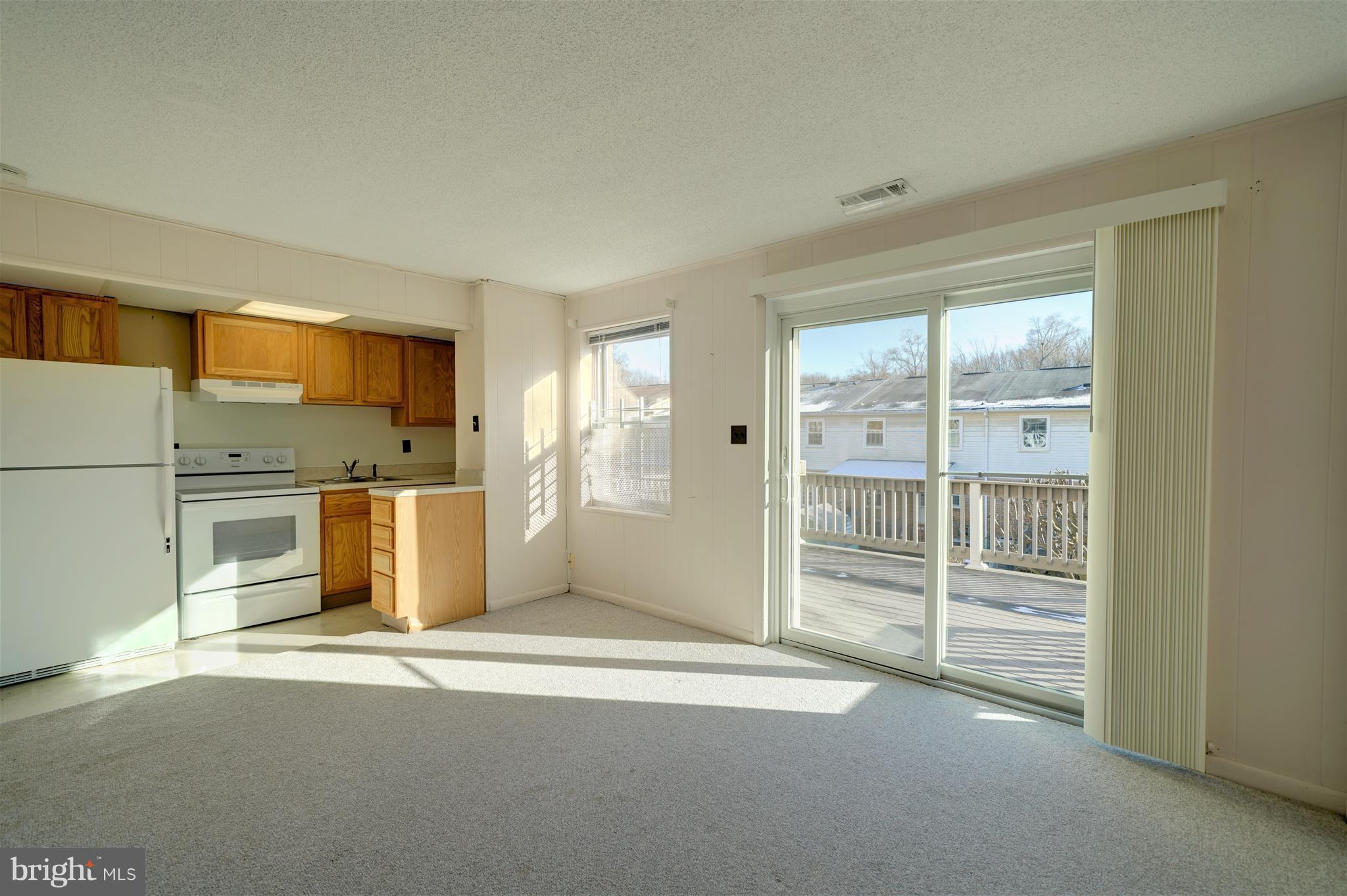 9923 Maidbrook Road Baltimore, MD 21234 - Photo 16 of 30 Sunny basement w/window and sliders to deck