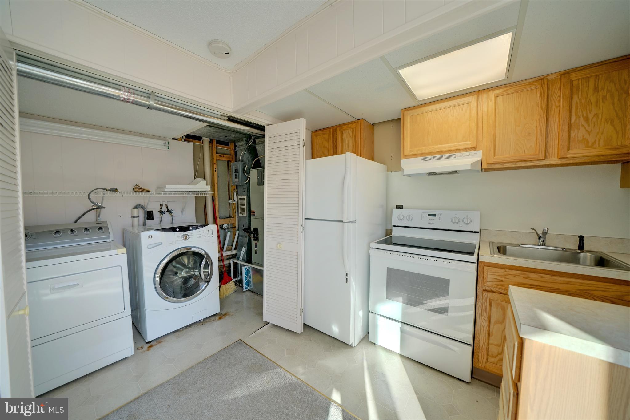9923 Maidbrook Road Baltimore, MD 21234 - Photo 20 of 30 Basement laundry w/front loader washing machine