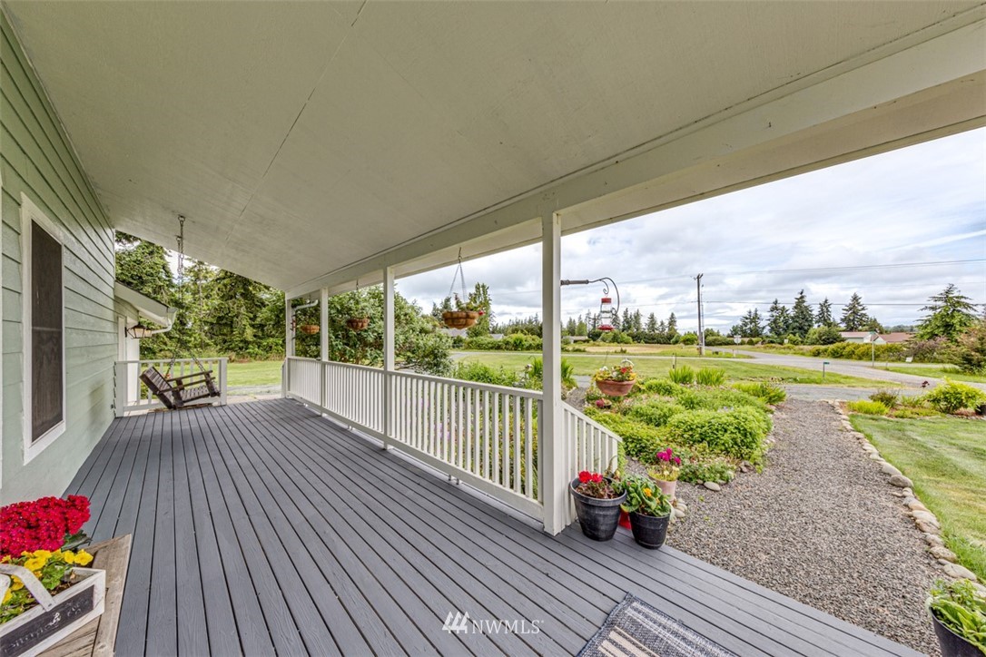 10 Klahn Country Road Sequim, WA 98382 - Photo 3 of 40 a view of a balcony with lake view and a floor to ceiling window