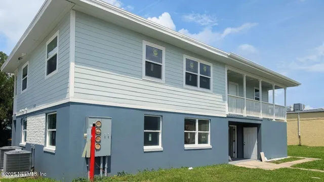 a front view of a house with garage