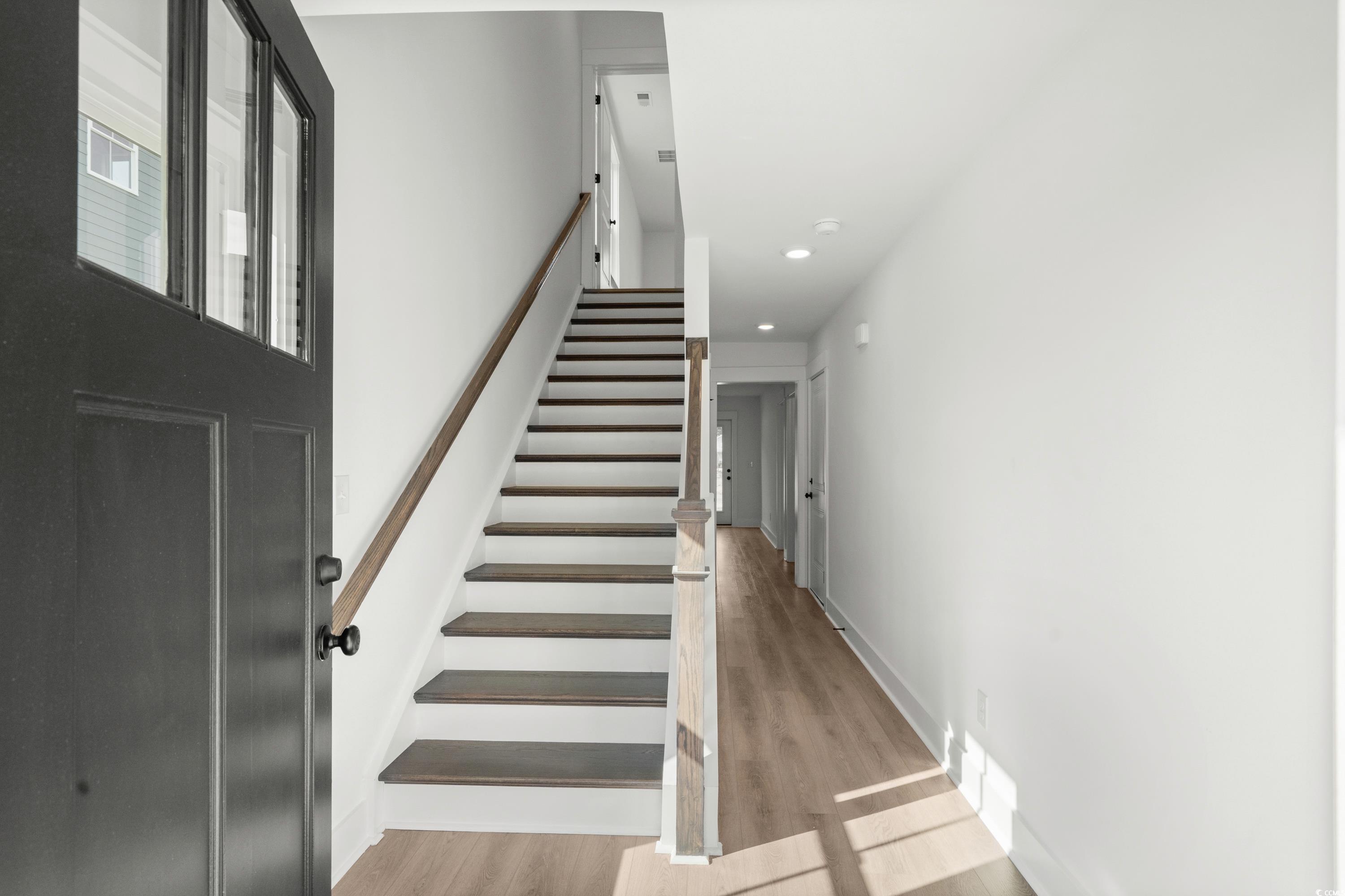 4414 Kingsport Road, Unit 1501 Little River, SC 29566 - Photo 3 of 30 Staircase featuring wood finished floors and recessed lighting