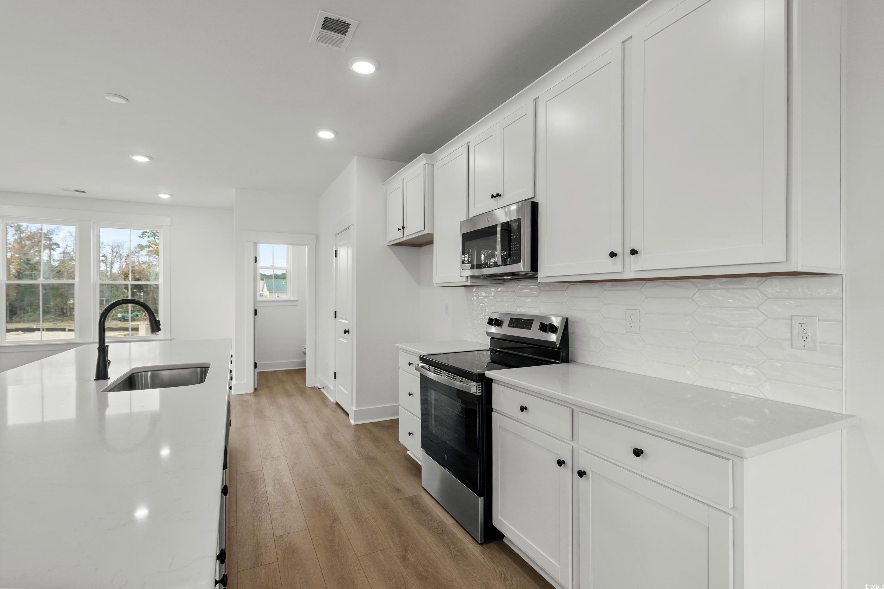 4414 Kingsport Road, Unit 1501 Little River, SC 29566 - Photo 7 of 30 Large quartz countertop kitchen island