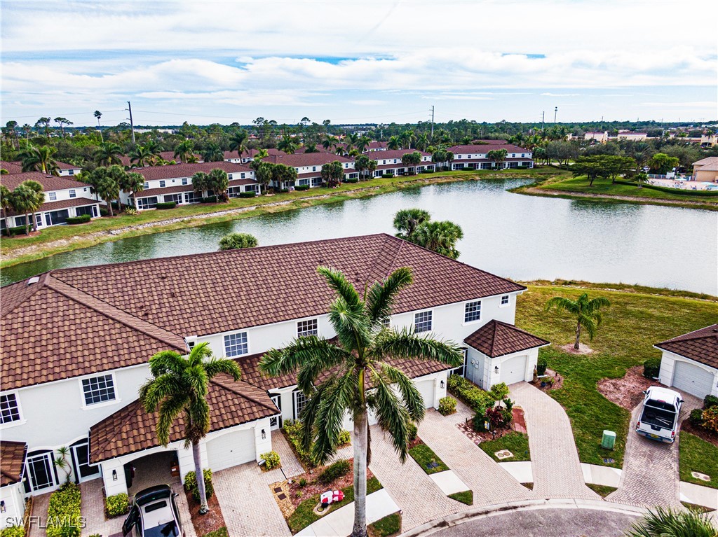 11753 Eros Road Lehigh Acres, FL 33971 - Photo 1 of 34 an aerial view of a house with pool and ocean view