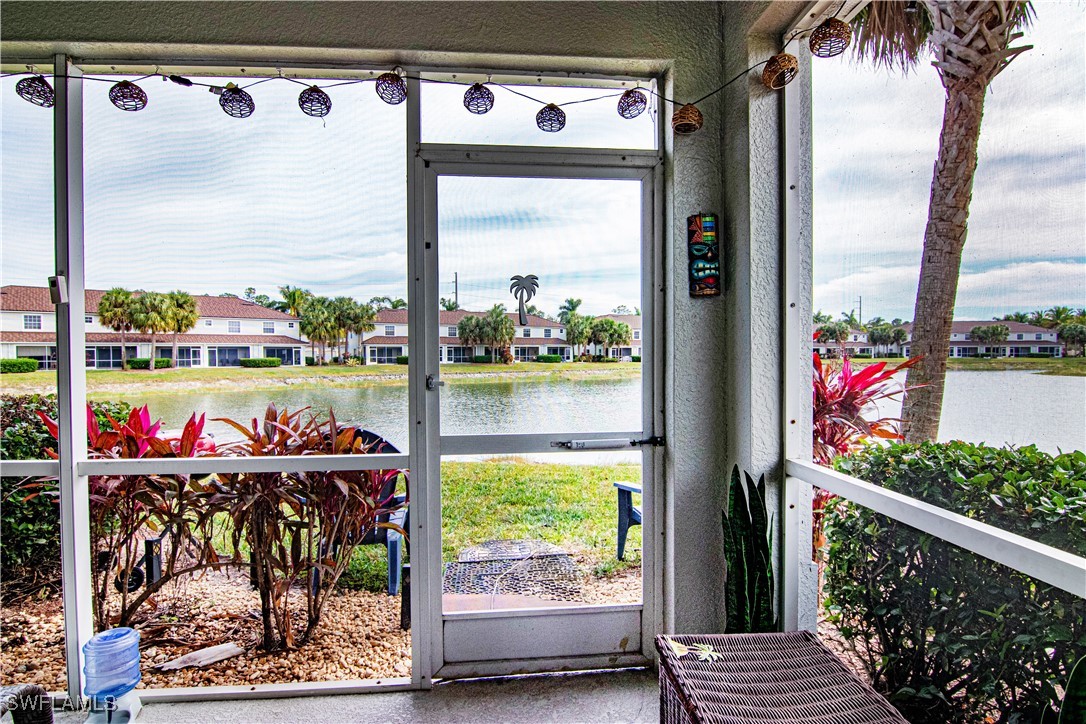 11753 Eros Road Lehigh Acres, FL 33971 - Photo 25 of 34 a view of a chairs and table in a balcony