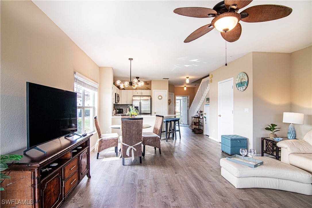 11753 Eros Road Lehigh Acres, FL 33971 - Photo 10 of 34 a living room with furniture and a flat screen tv