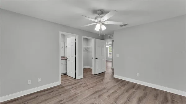 a view of an empty room and wooden floor