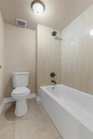 a bathroom with a shower toilet and sink