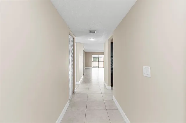 a kitchen with stainless steel appliances granite countertop a refrigerator and a stove