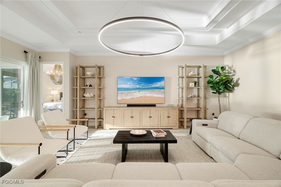 13670 Blue Bay Circle Fort Myers, FL 33913 - Photo 13 of 50 a living room with furniture a rug and a painting