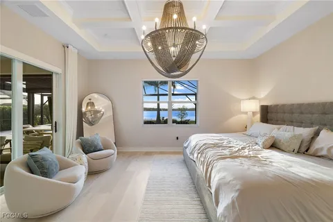 a bed room with a bed and a large mirror