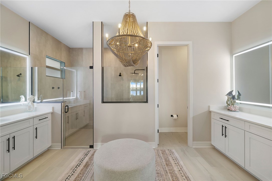 13670 Blue Bay Circle Fort Myers, FL 33913 - Photo 16 of 50 a spacious bathroom with a sink a toilet and shower