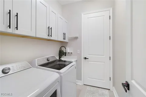 a kitchen with a cabinets and white stove