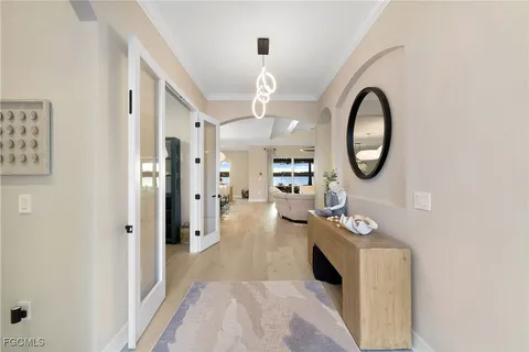 a view of living room with furniture and a mirror