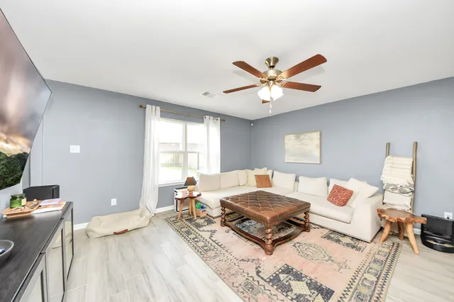 a bedroom with a baby crib and a window