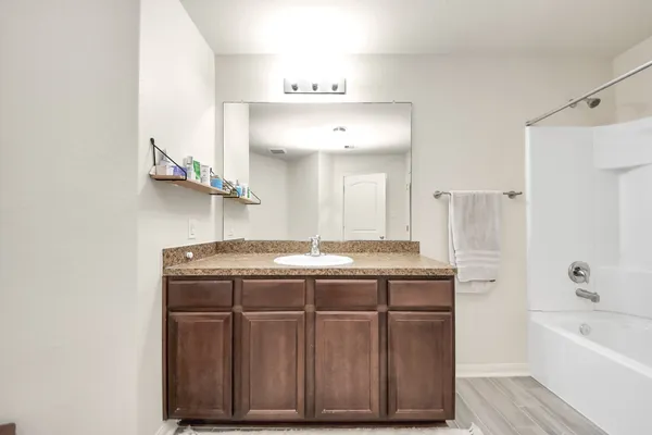 a kitchen with stainless steel appliances granite countertop a stove and a refrigerator