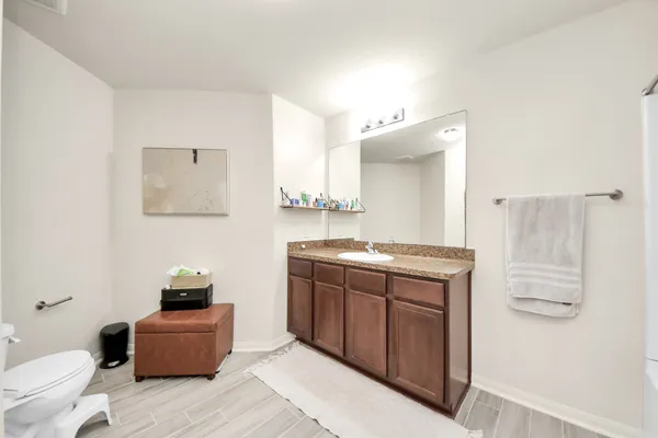 a bathroom with a bathtub a sink and a shower