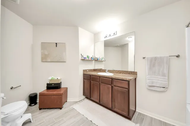 a bathroom with a bathtub a sink and a shower