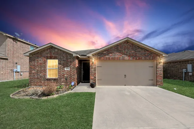 an aerial view of a house with a swimming pool