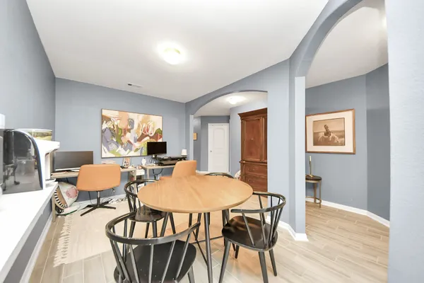 a dining room with furniture and window