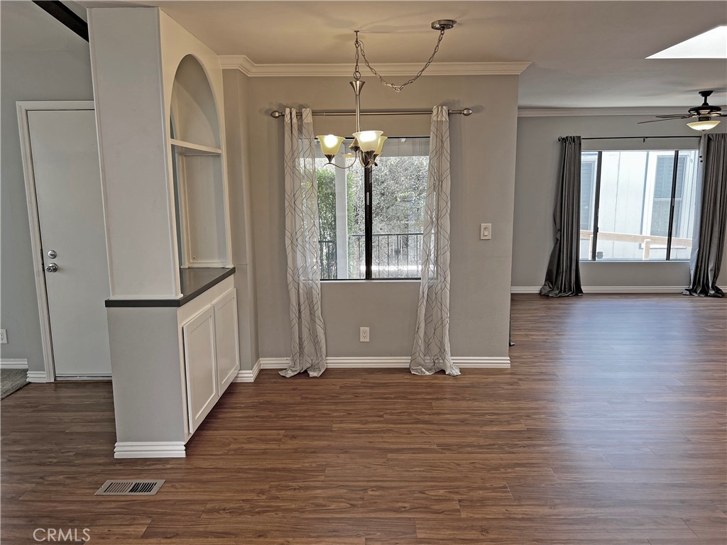 1352 Silver Lake Place, Unit 87 Brea, CA 92821 - Photo 14 of 51 a view of a room with wooden floor and entryway