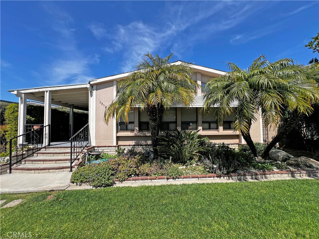 1352 Silver Lake Place, Unit 87 Brea, CA 92821 - Photo 2 of 51 a view of a house with backyard garden and patio