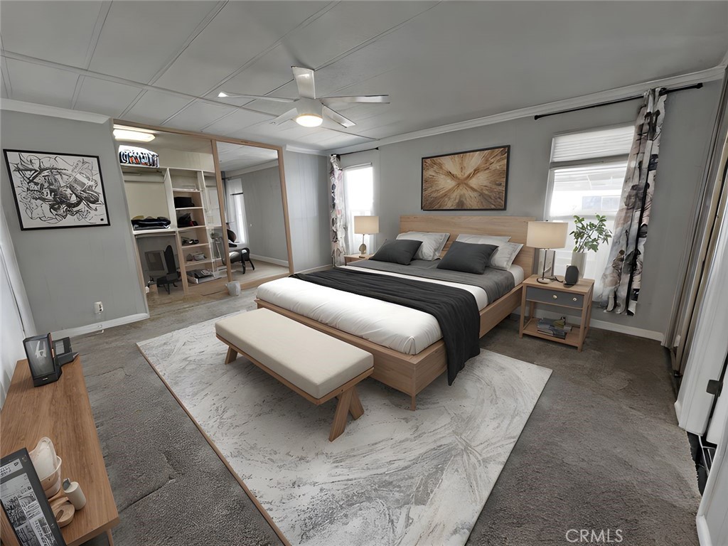 1352 Silver Lake Place, Unit 87 Brea, CA 92821 - Photo 22 of 51 a spacious bedroom with a bed a couch and a window