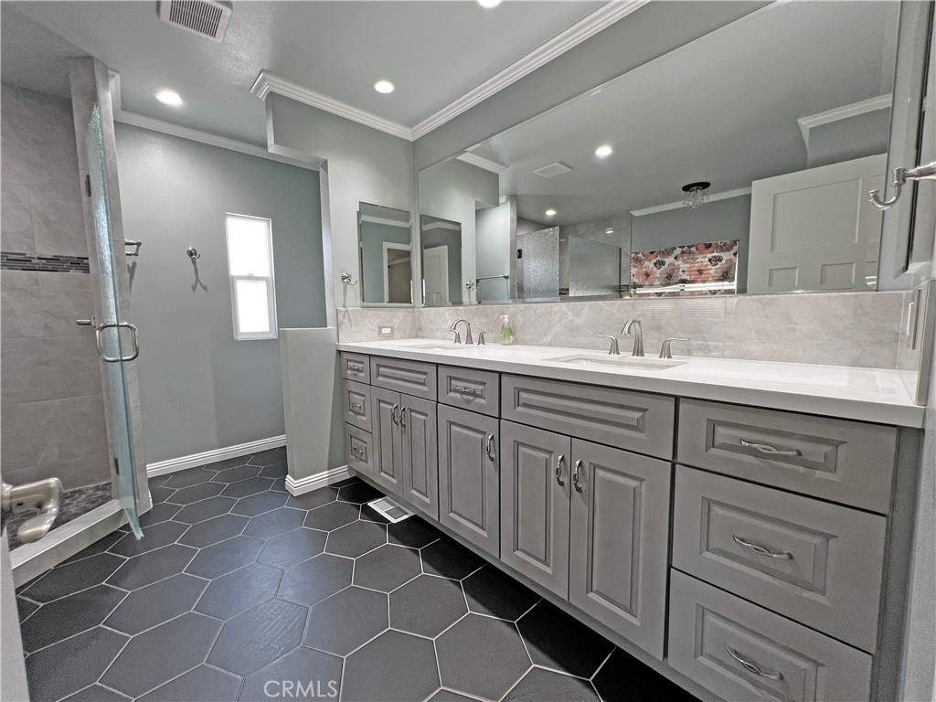 1352 Silver Lake Place, Unit 87 Brea, CA 92821 - Photo 24 of 51 a bathroom with a double vanity sink mirror and