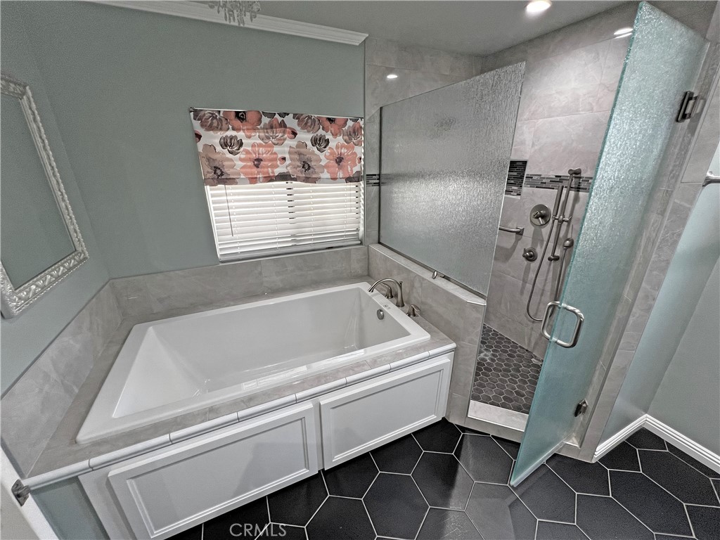 1352 Silver Lake Place, Unit 87 Brea, CA 92821 - Photo 25 of 51 a bathroom with a bathtub and a shower