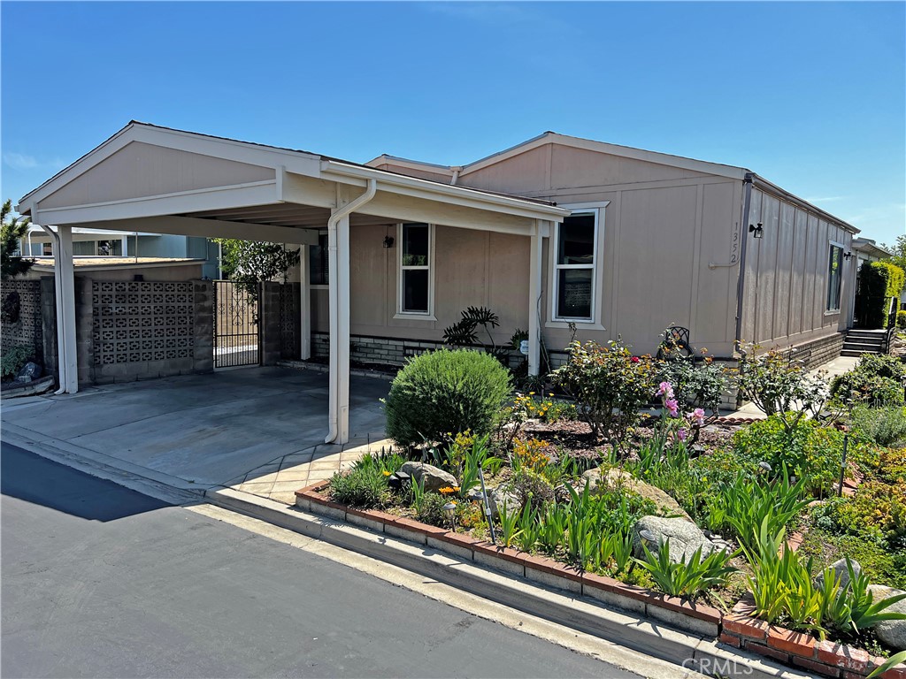 1352 Silver Lake Place, Unit 87 Brea, CA 92821 - Photo 3 of 51 front view of a house with a small yard