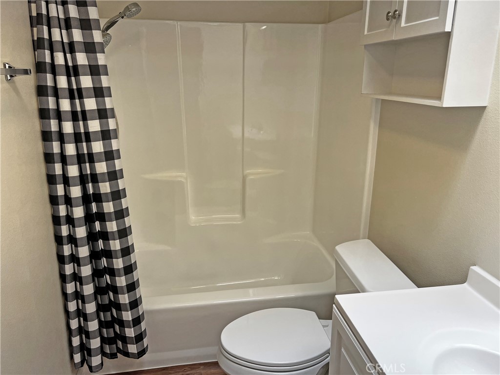 1352 Silver Lake Place, Unit 87 Brea, CA 92821 - Photo 31 of 51 a bathroom with a toilet a sink and a bathtub