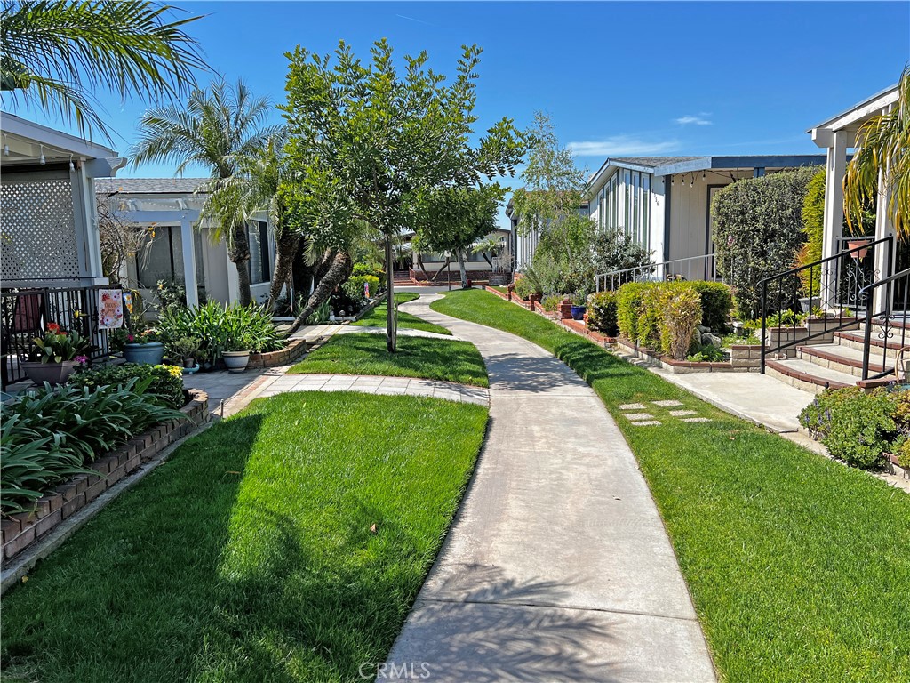 1352 Silver Lake Place, Unit 87 Brea, CA 92821 - Photo 38 of 51 a view of a house with a yard and potted plants