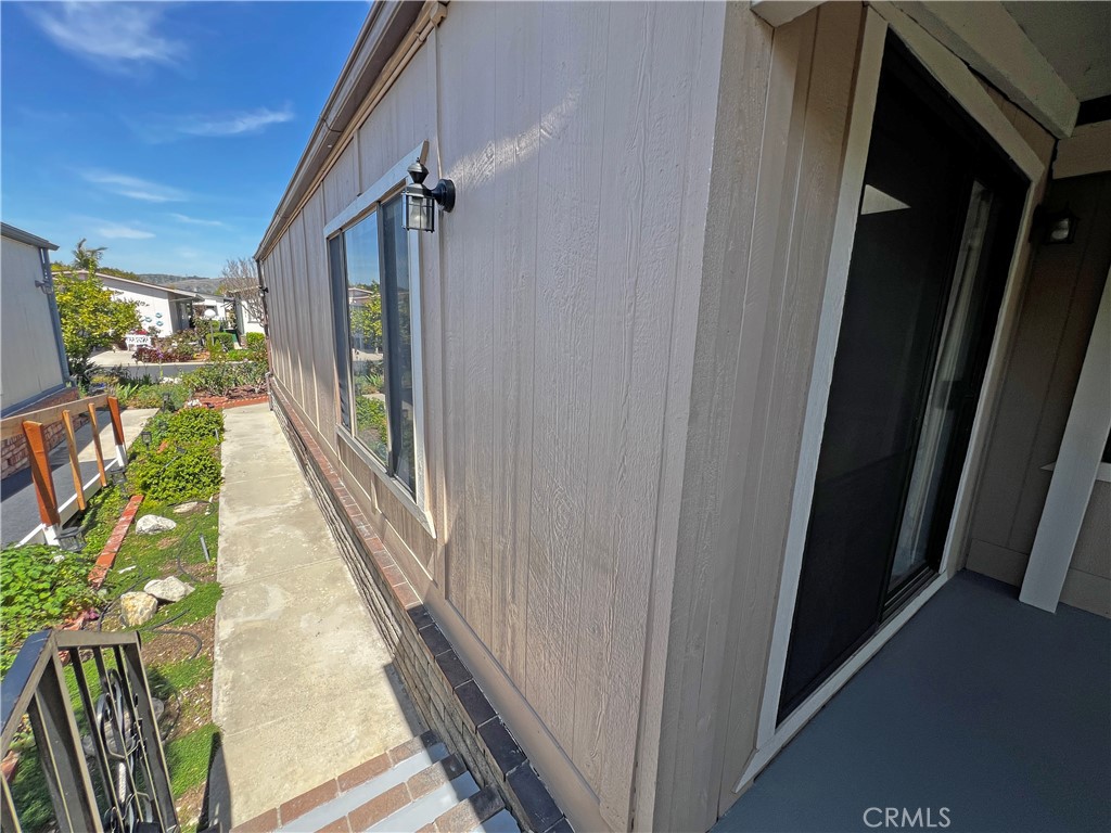 1352 Silver Lake Place, Unit 87 Brea, CA 92821 - Photo 39 of 51 a view of a hallway with wooden floor and stairs