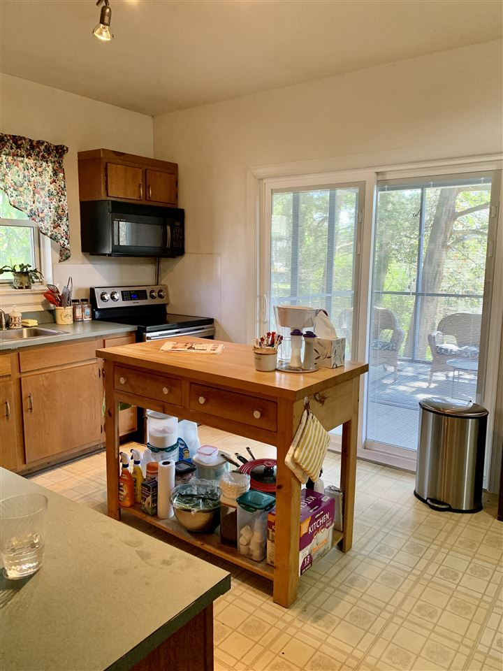 1445 Cole Mill Road Durham, NC 27705 - Photo 5 of 15 Sliding doors lead to large screen porch. Kitchen