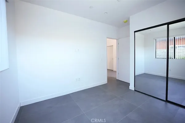 a view of hallway with wooden floor
