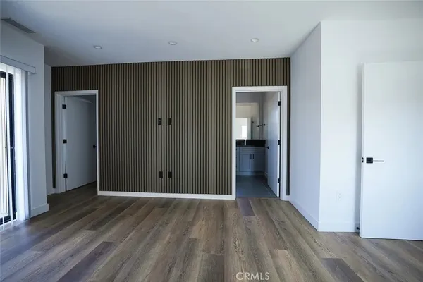 a kitchen with stainless steel appliances granite countertop a refrigerator stove and microwave