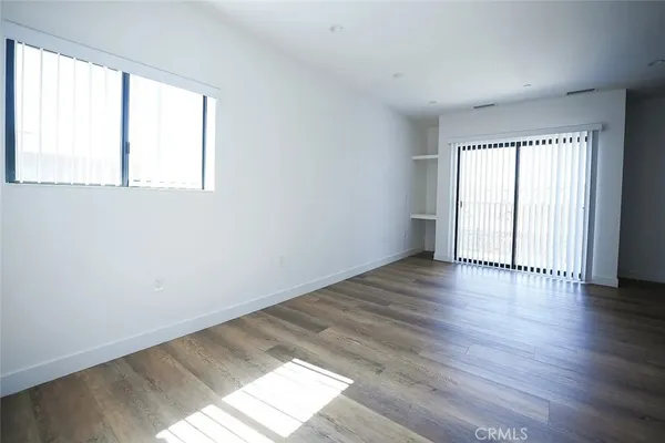 a view of a hallway with washer and dryer