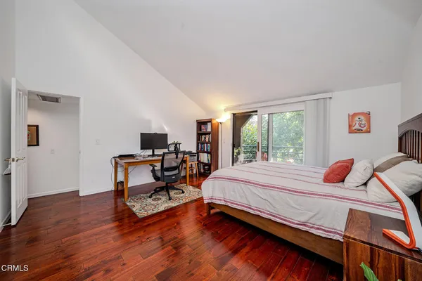 a bedroom with furniture and a window