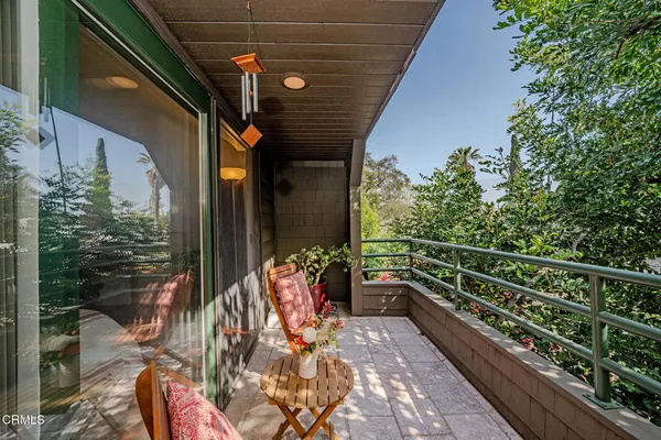 a view of balcony with furniture
