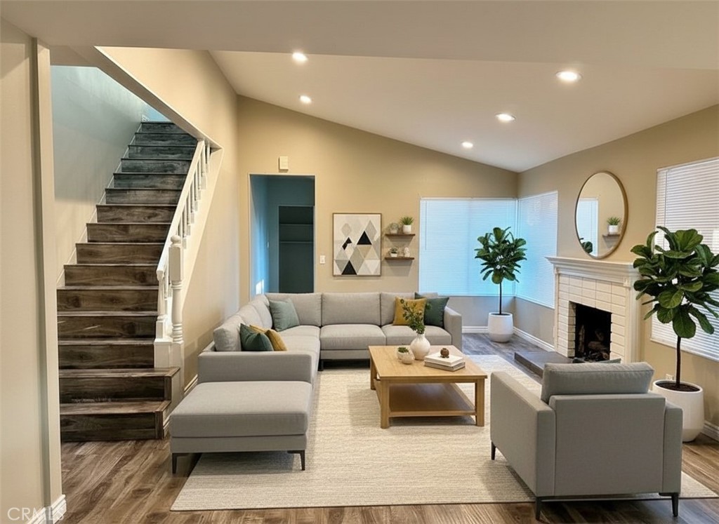 14911 Doheny Circle Irvine, CA 92604 - Photo 2 of 10 a living room with furniture and a fireplace