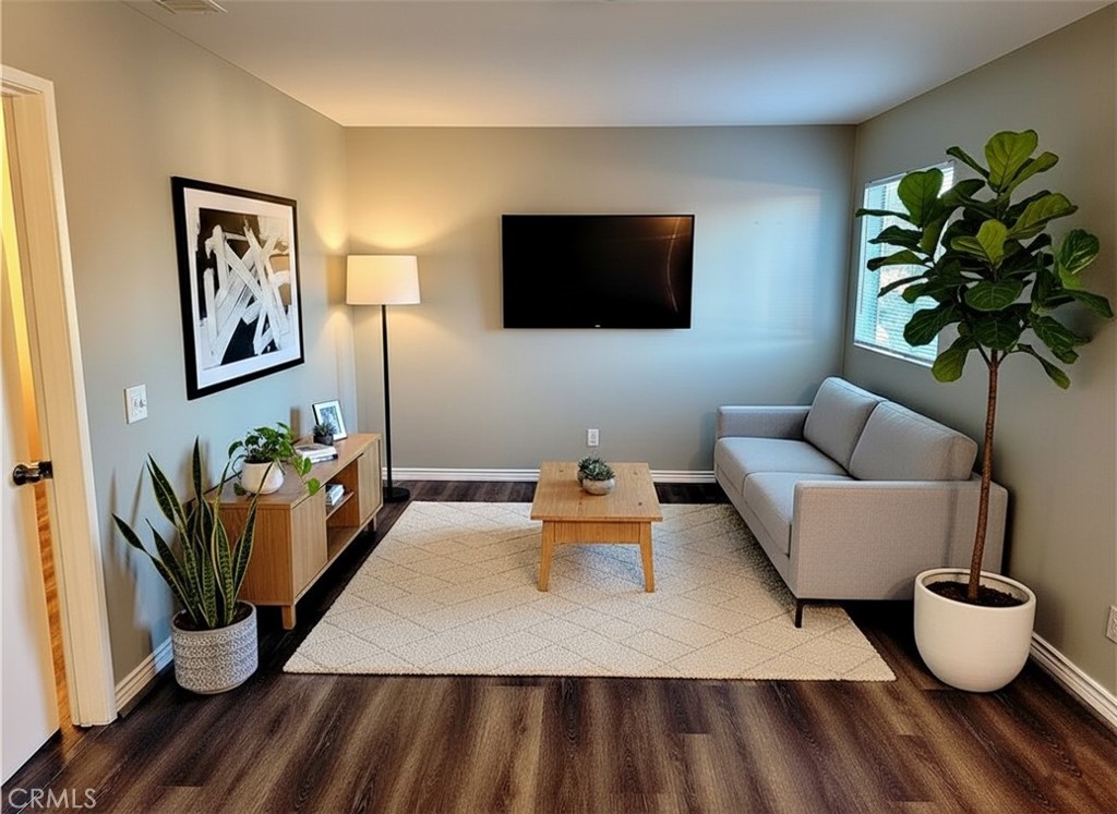 14911 Doheny Circle Irvine, CA 92604 - Photo 7 of 10 a living room with furniture and a flat screen tv
