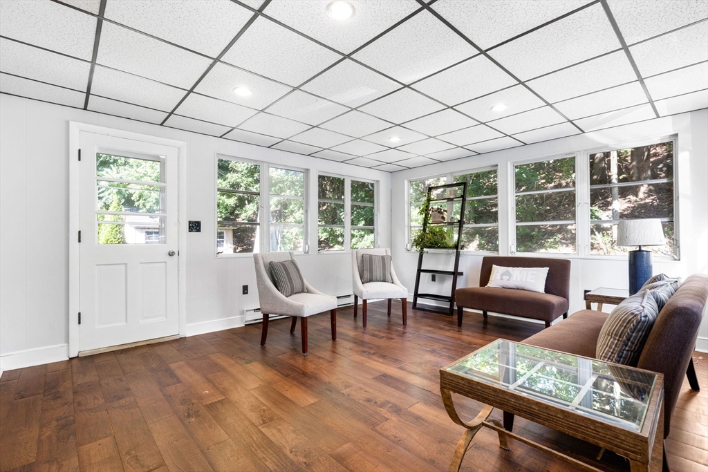 10 Marie Avenue Stoneham, MA 02180 - Photo 11 of 41 a living room with furniture and large windows