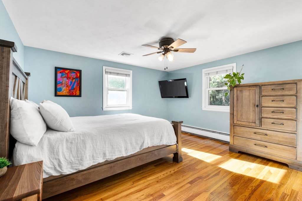 10 Marie Avenue Stoneham, MA 02180 - Photo 14 of 41 a bedroom with a bed and a flat screen tv