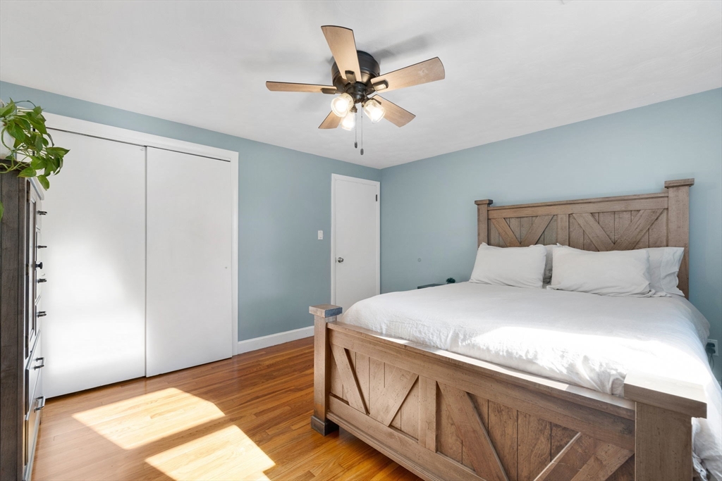 10 Marie Avenue Stoneham, MA 02180 - Photo 15 of 41 a bedroom with a bed and a ceiling fan