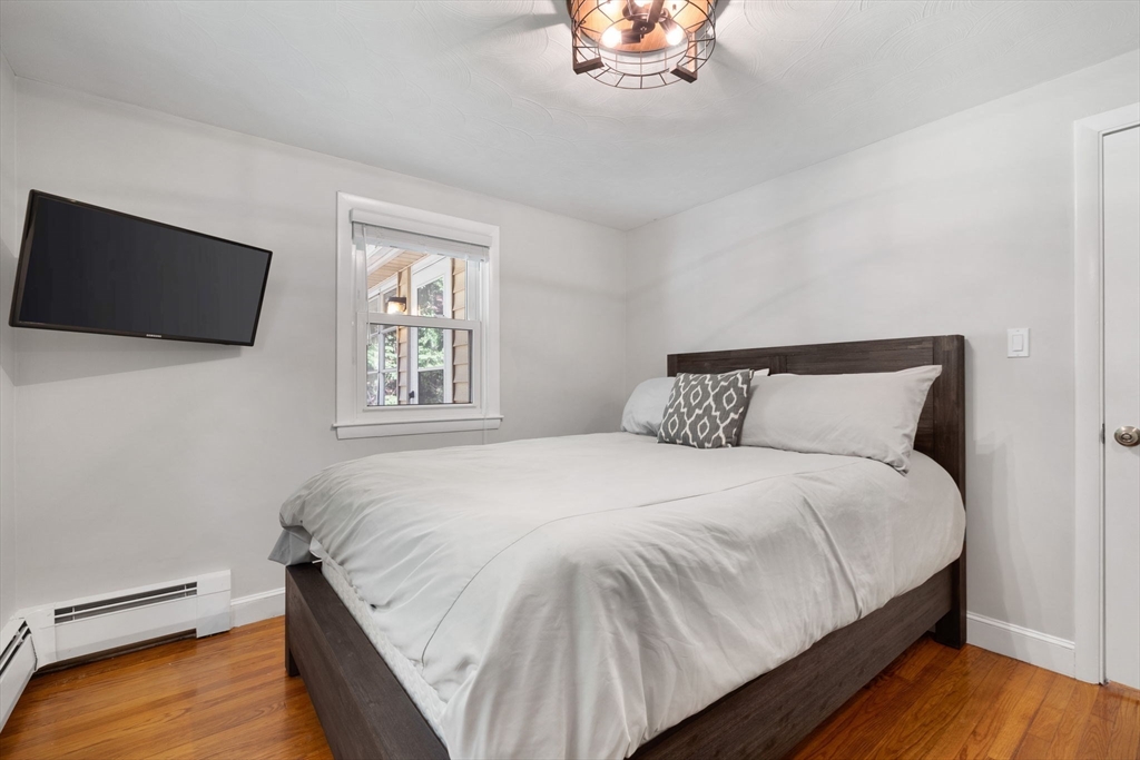 10 Marie Avenue Stoneham, MA 02180 - Photo 17 of 41 a bedroom with a bed and a flat screen tv