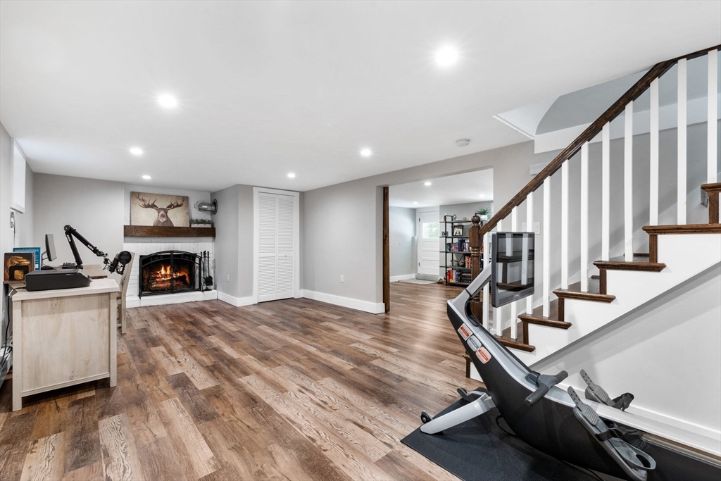 10 Marie Avenue Stoneham, MA 02180 - Photo 20 of 41 a view of a livingroom with an entryway and a fireplace