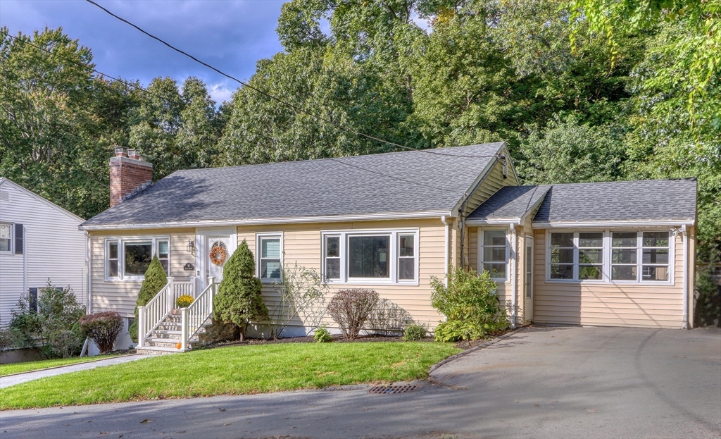 10 Marie Avenue Stoneham, MA 02180 - Photo 2 of 41 a house that has a tree in front of it