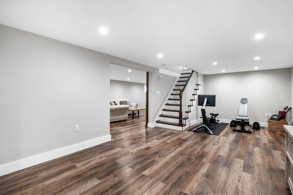 10 Marie Avenue Stoneham, MA 02180 - Photo 21 of 41 a living room with furniture and stairs