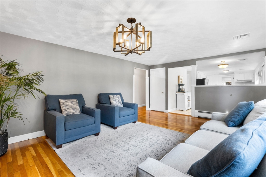 10 Marie Avenue Stoneham, MA 02180 - Photo 4 of 41 a living room with furniture and a wooden floor